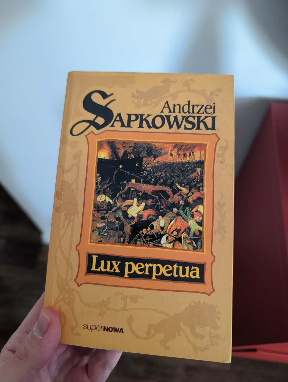 A stack of Sapkowski books offered to the group