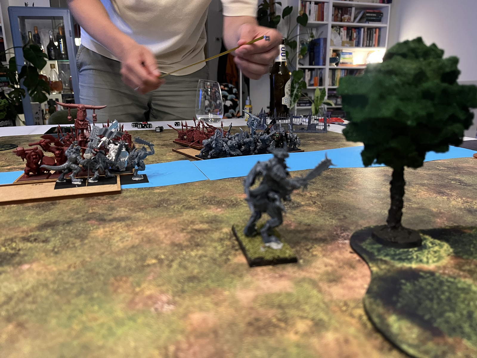 Black Orcs smashing through the Saurus