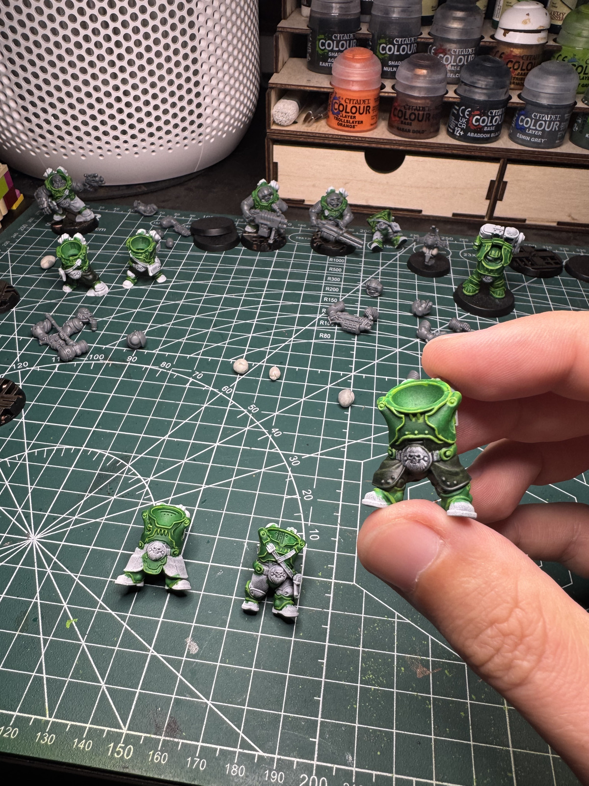 A finished green model and another green one started